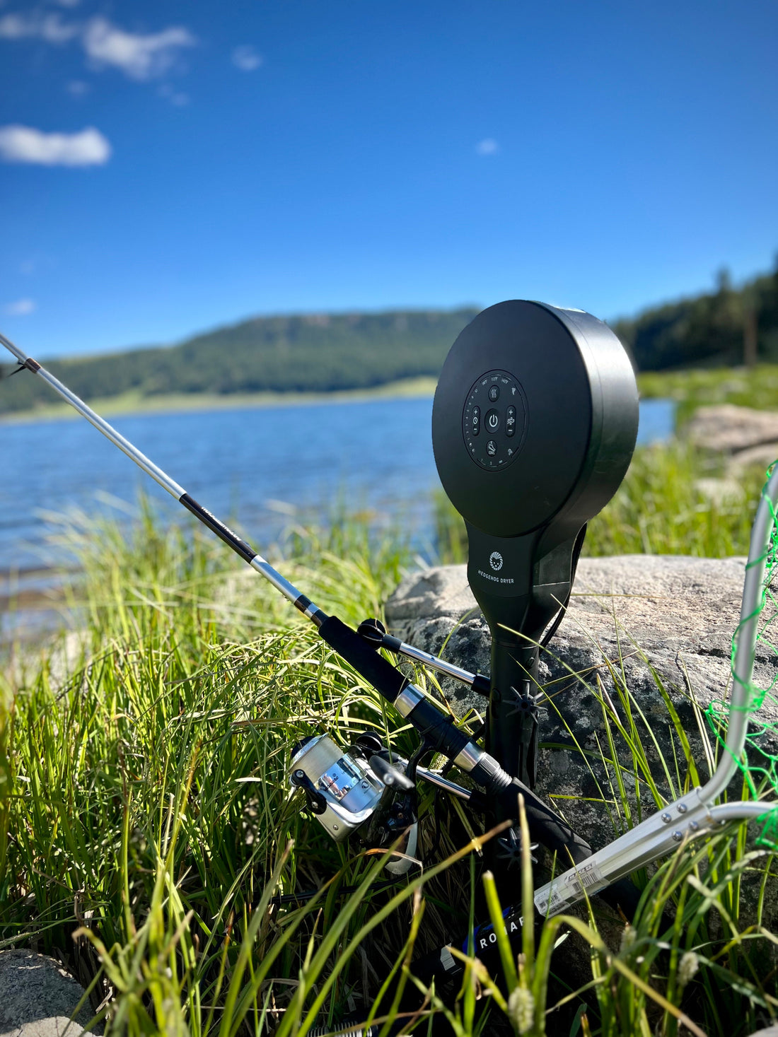 Hedgehog Dryer and fishing pole by a lake